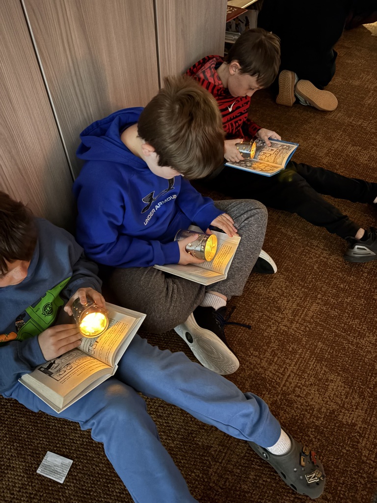 Student with homemade flashlight