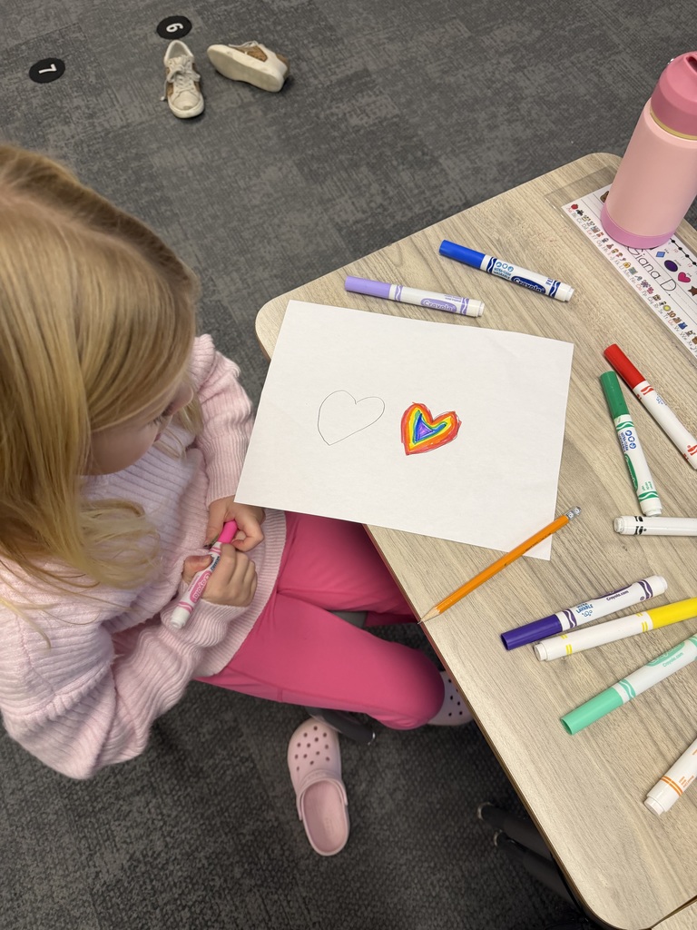 student drawing in the classroom