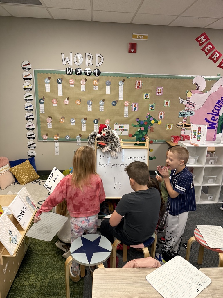 first graders writing in class