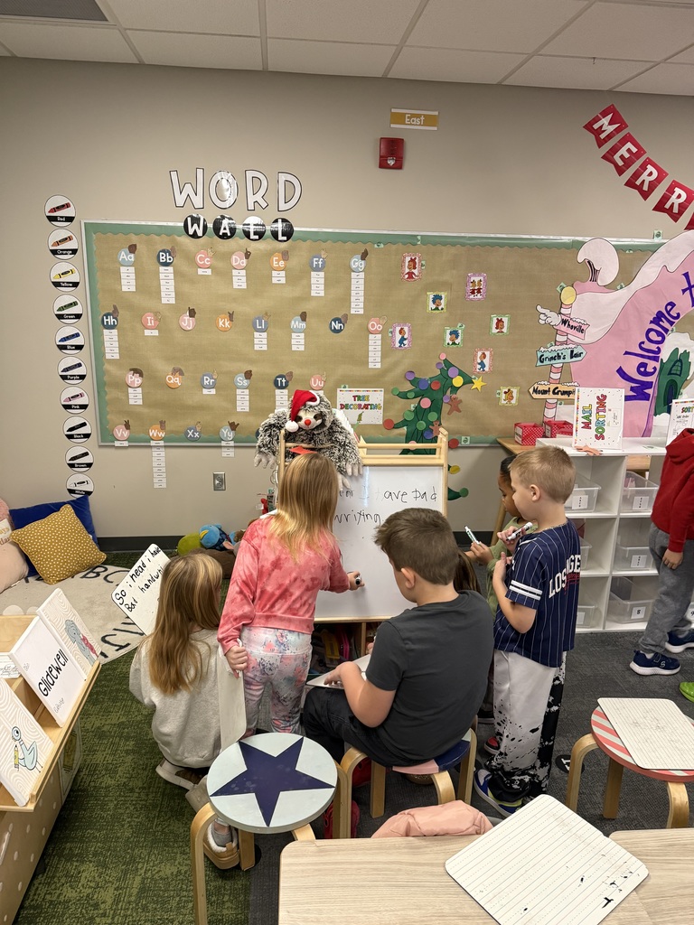 first graders writing in class