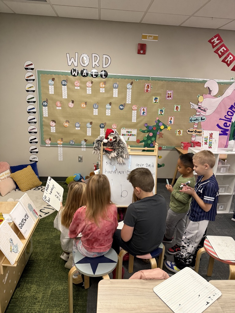 first graders writing in class