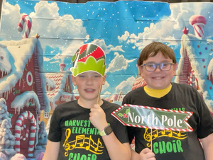 students posing in christmas festive gear in a photo booth