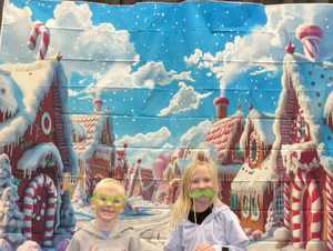 students posing in christmas festive gear in a photo booth