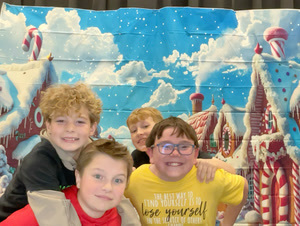 students posing in christmas festive gear in a photo booth