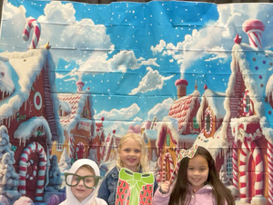 students posing in christmas festive gear in a photo booth
