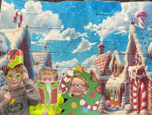 students posing in christmas festive gear in a photo booth