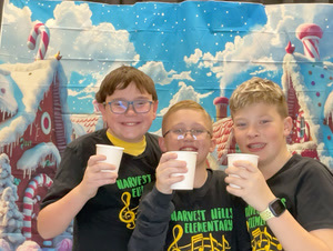 students posing in christmas festive gear in a photo booth