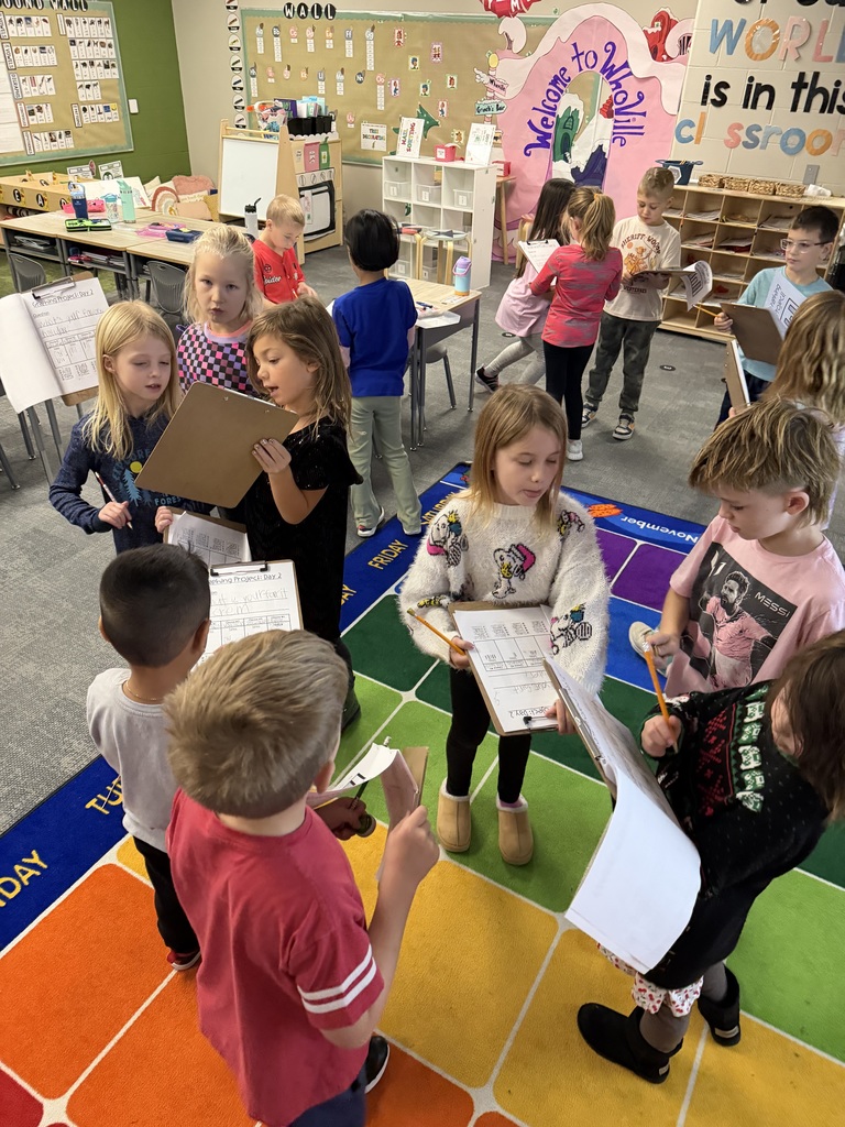 students working on a survey in class