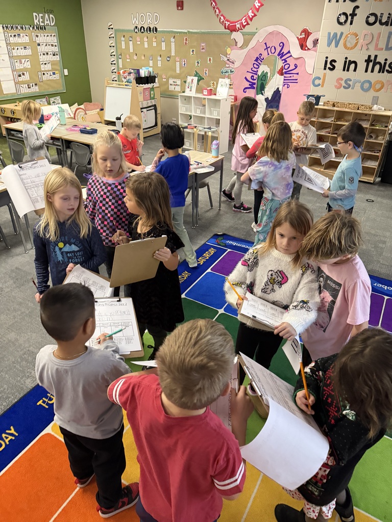 students working on a survey in class