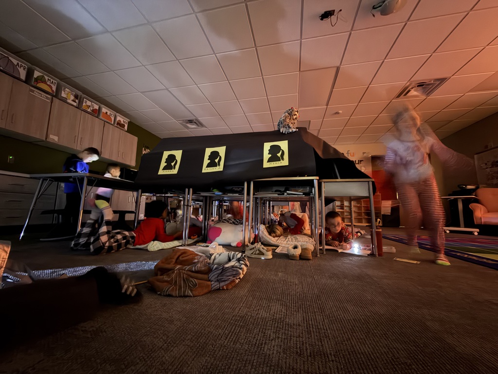 first graders using their desks as tents