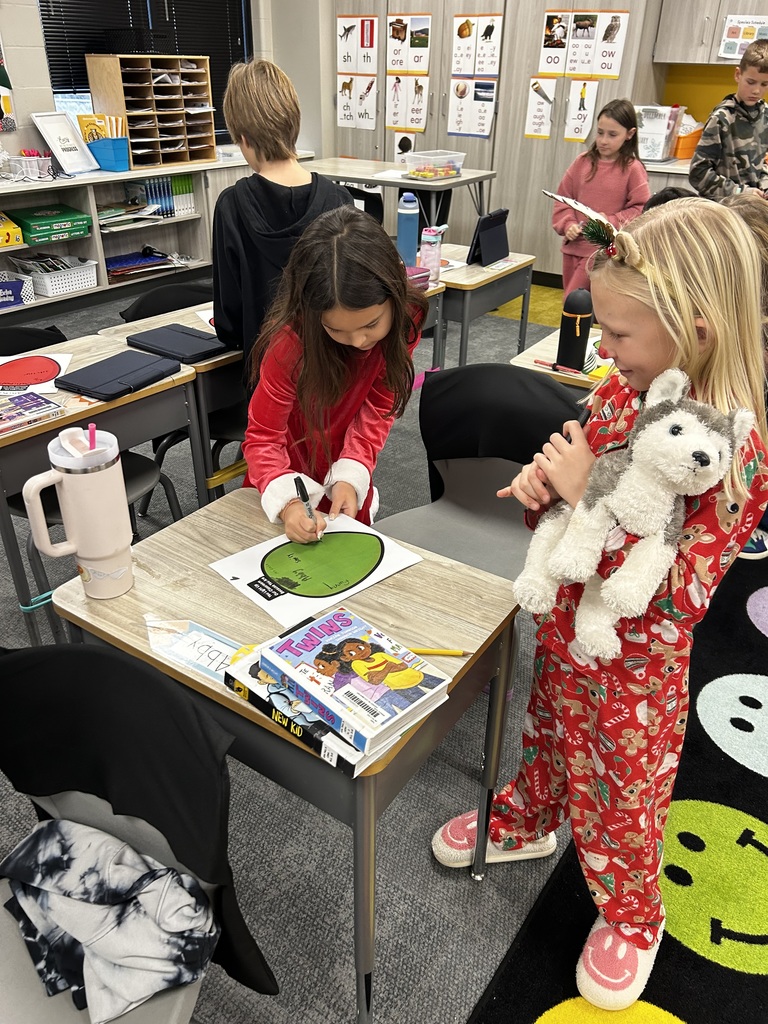 third graders doing an adjective project in class