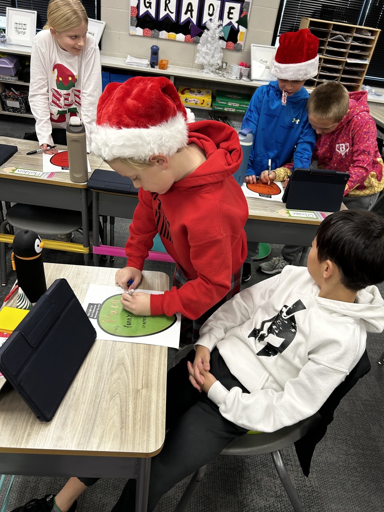 third graders doing an adjective project in class