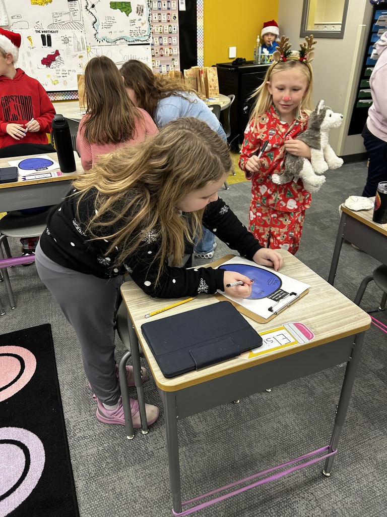 third graders doing an adjective project in class
