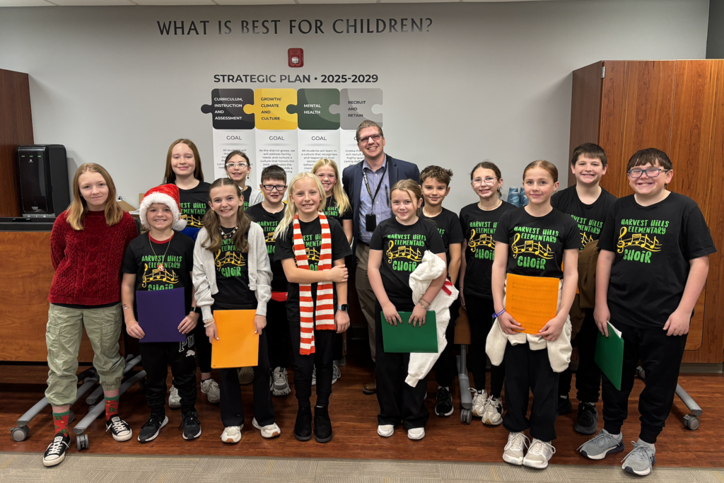 carolers at an administration building