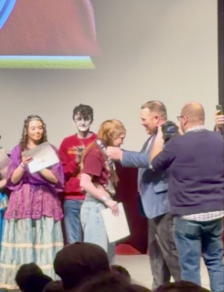 Student being awarded the medal for best actor