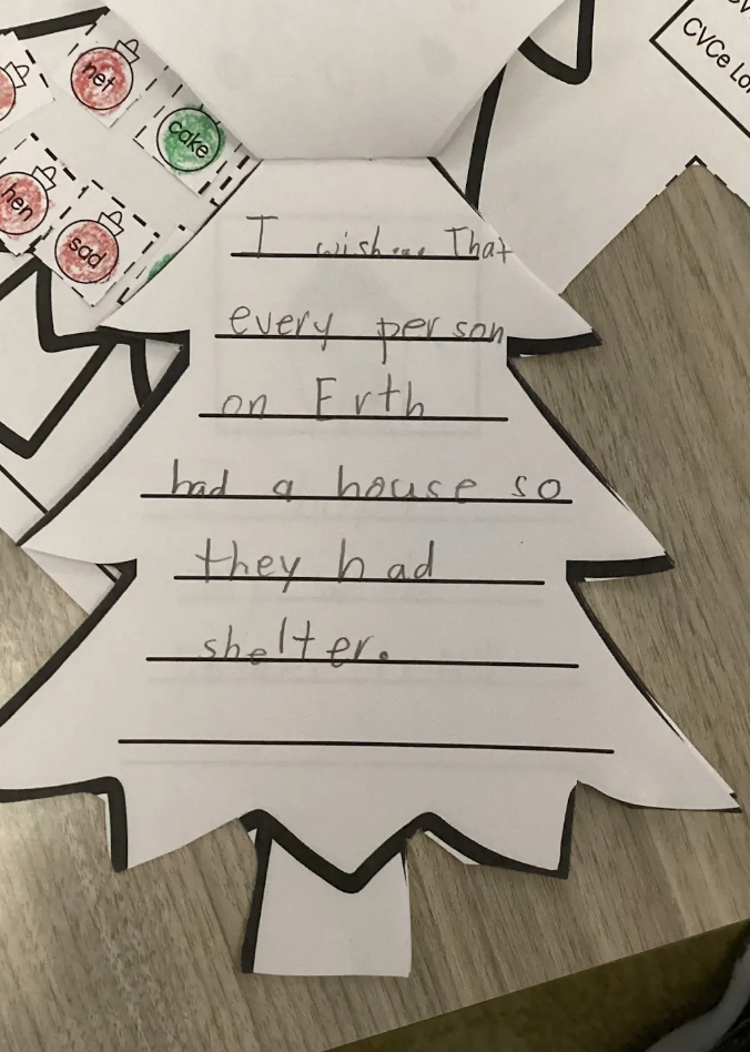 student writing piece wishing for shelter for everyone