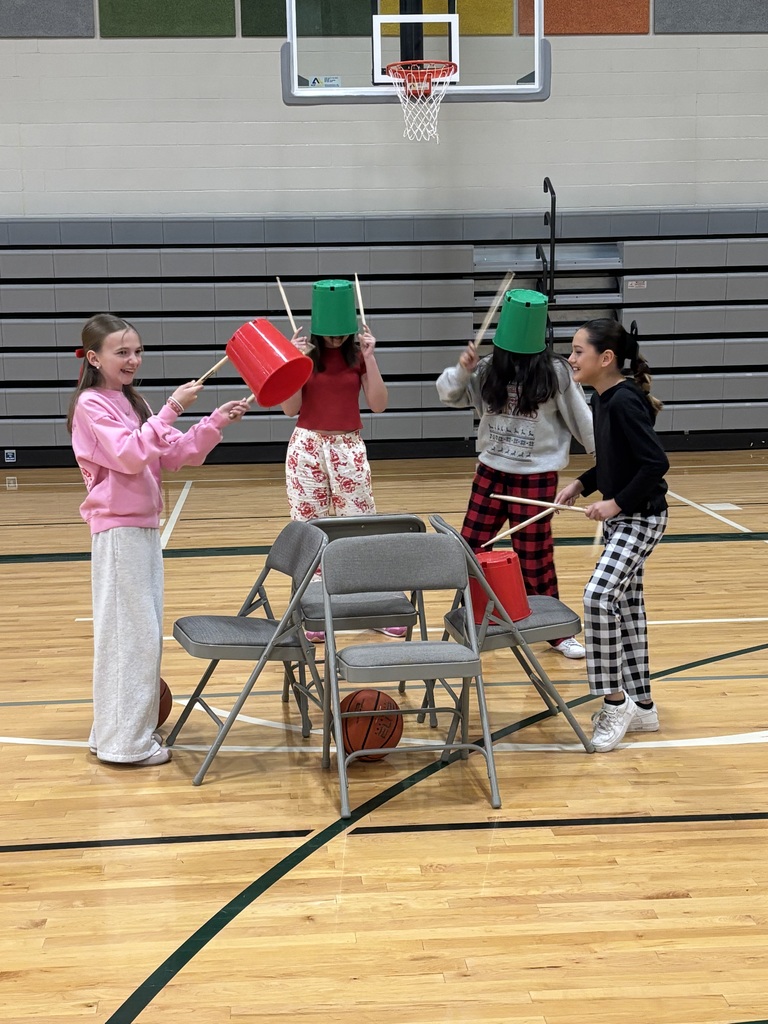 students making instruments with chairs and balls in music/pe class
