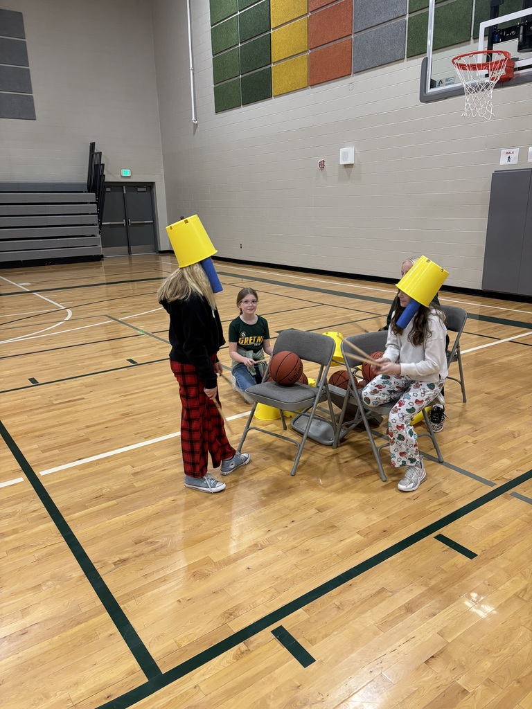 students making instruments with chairs and balls in music/pe class