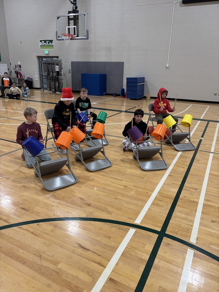 students making instruments with chairs and balls in music/pe class