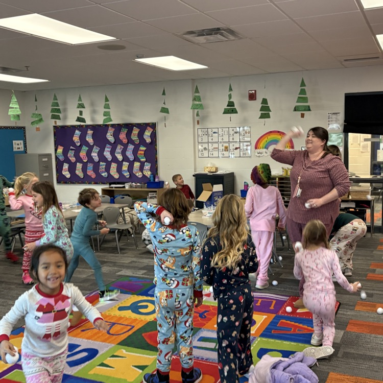 students laughing and throwing pretend snowballs