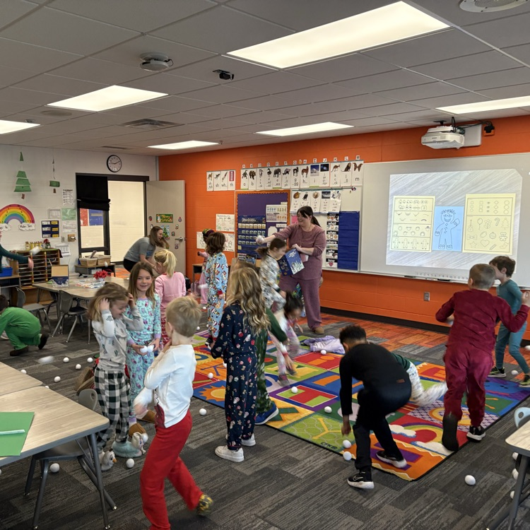 students laughing and throwing pretend snowballs