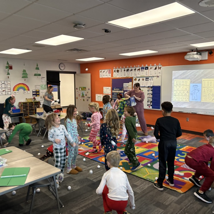 students laughing and throwing pretend snowballs