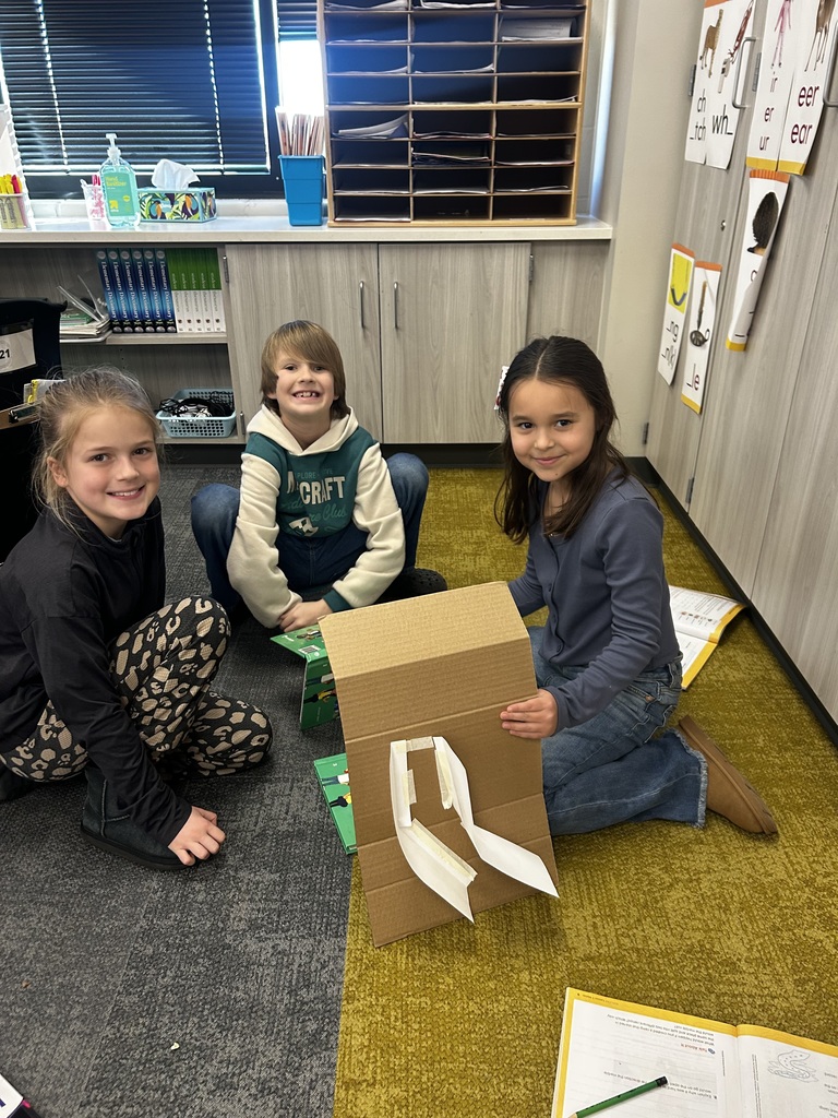 Students building ramps in a 3rd grade classroom