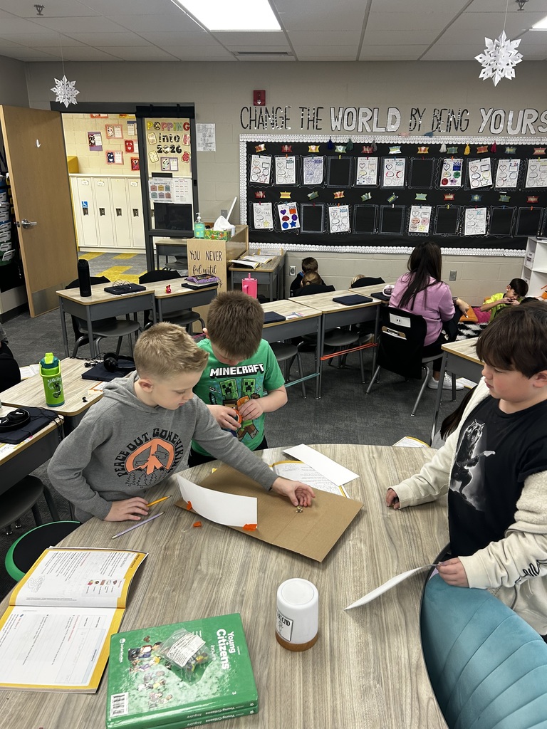 Students building ramps in a 3rd grade classroom
