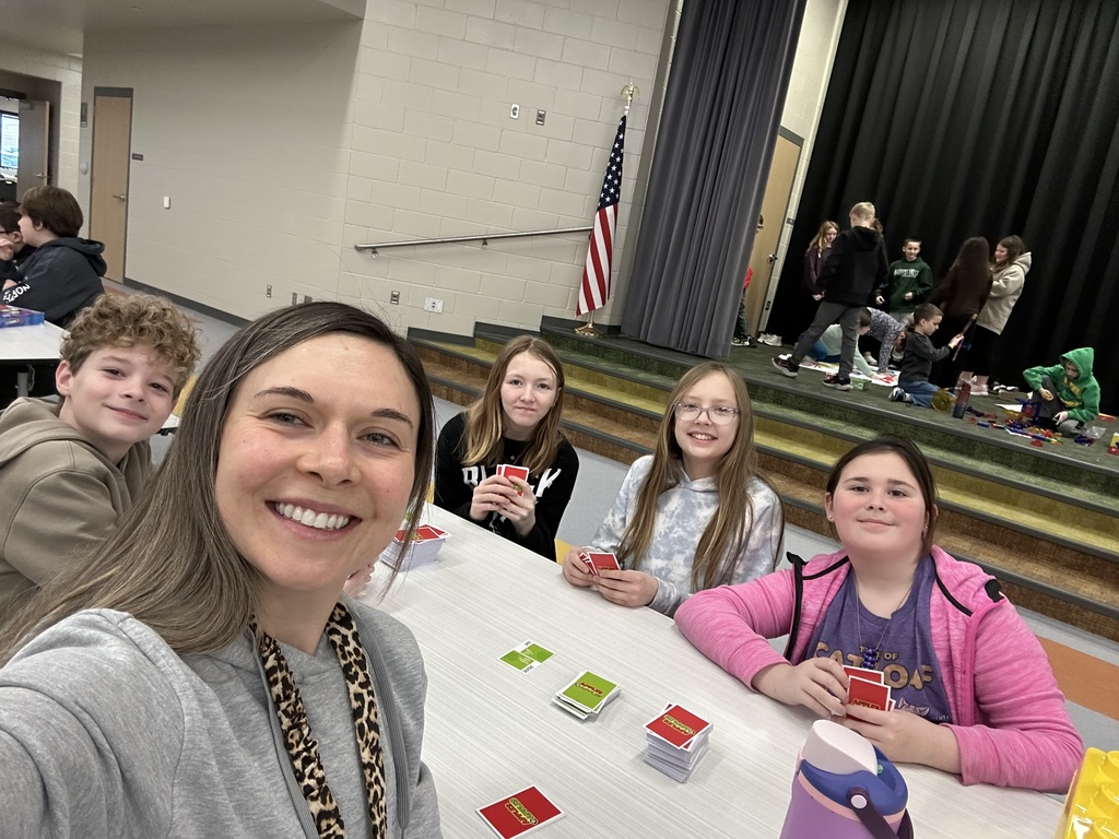 students playing game in the cafeteria to celebrate the 100th day of school