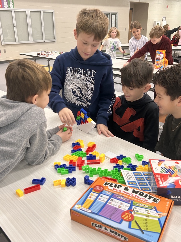 students playing game in the cafeteria to celebrate the 100th day of school