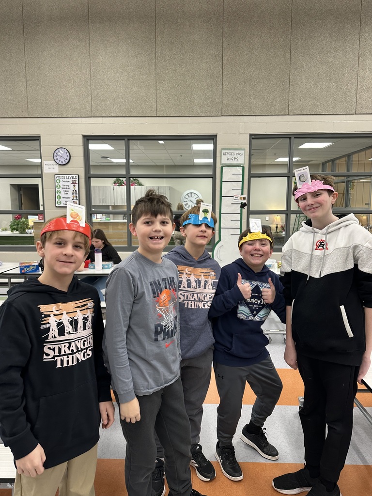 students playing game in the cafeteria to celebrate the 100th day of school