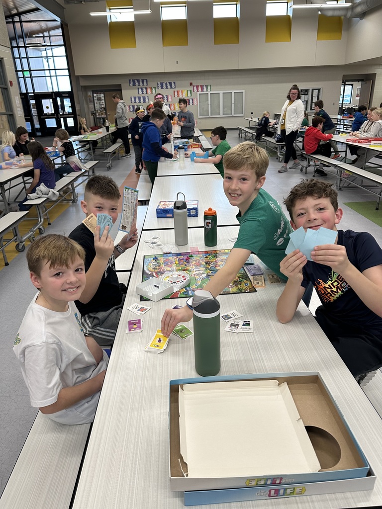 students playing game in the cafeteria to celebrate the 100th day of school