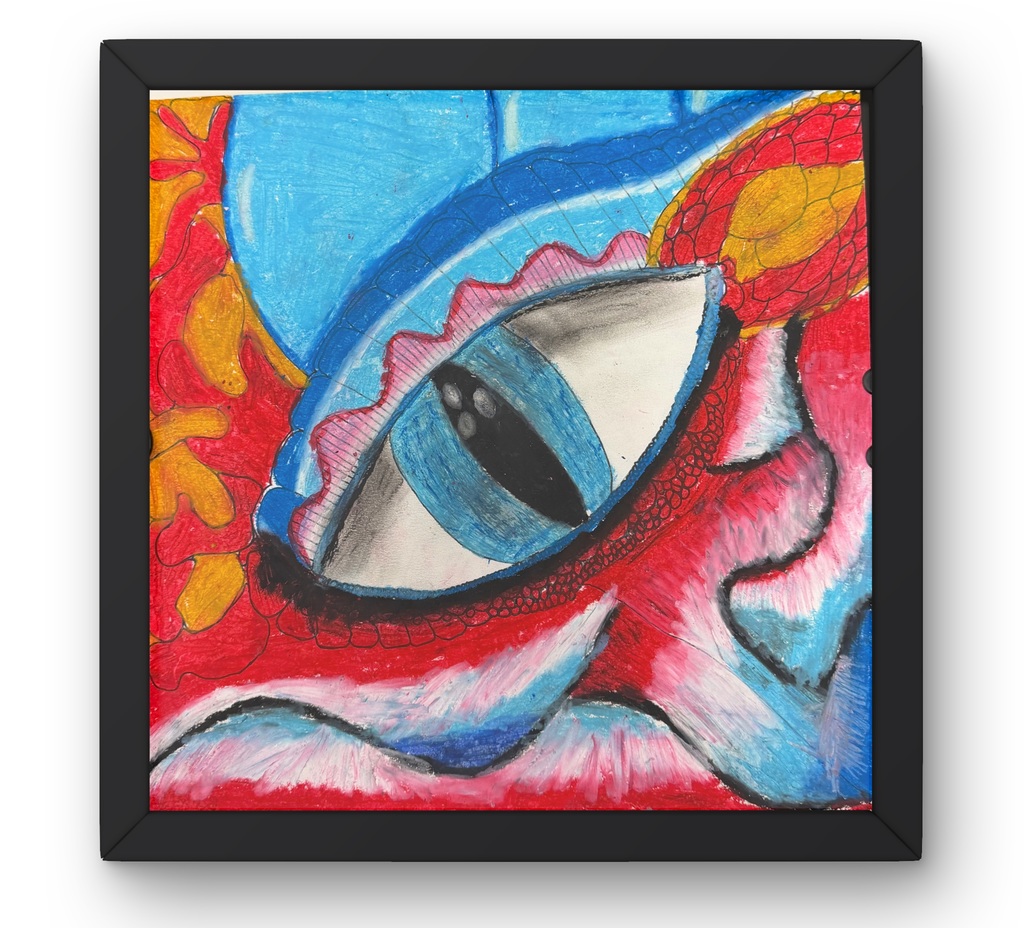 framed artwork of a colorful dragon eye in red, oranges and blues