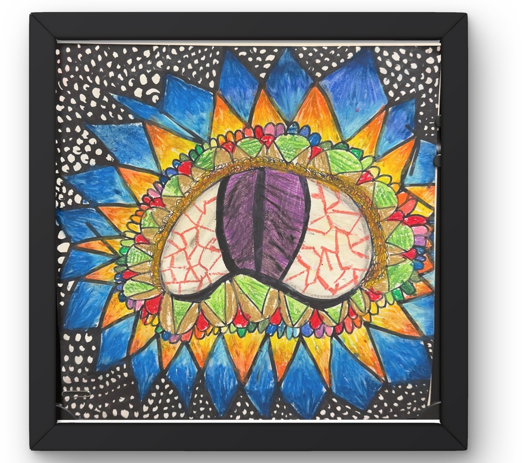 A framed artwork of an eye with red streaks