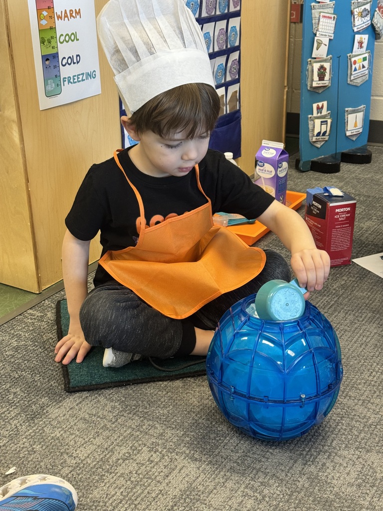 student pouring in ingredients to make ice cream from scratch