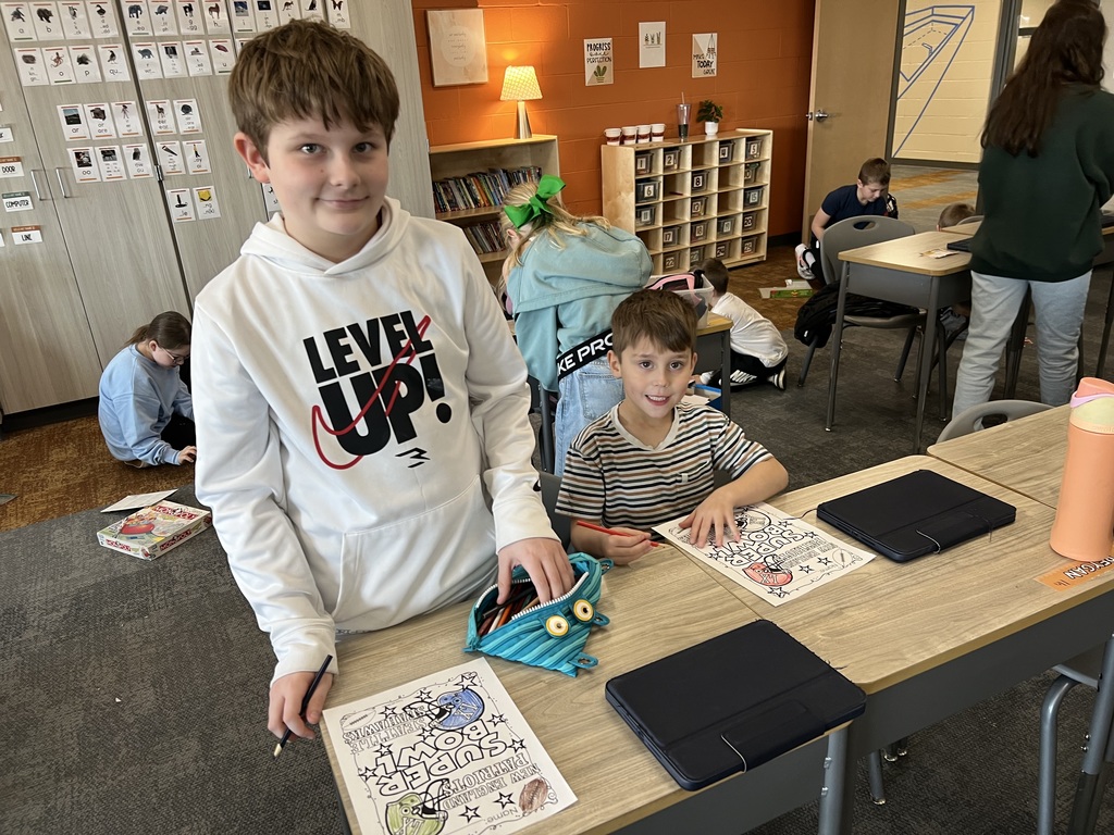 students coloring in a classroom