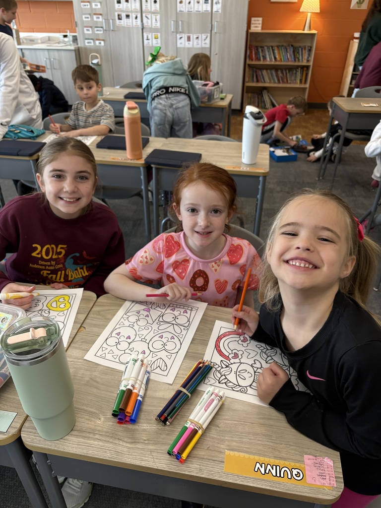students coloring in a classroom