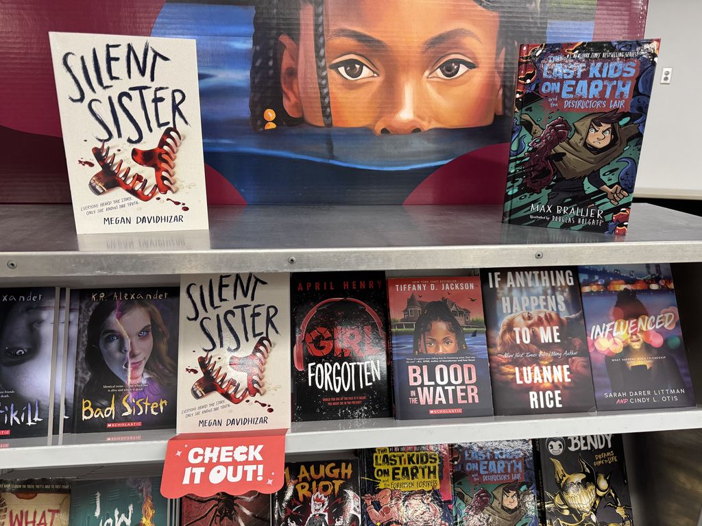 Books on a book cart. 