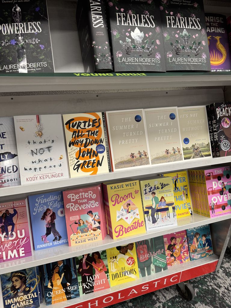 Books on a book cart. 
