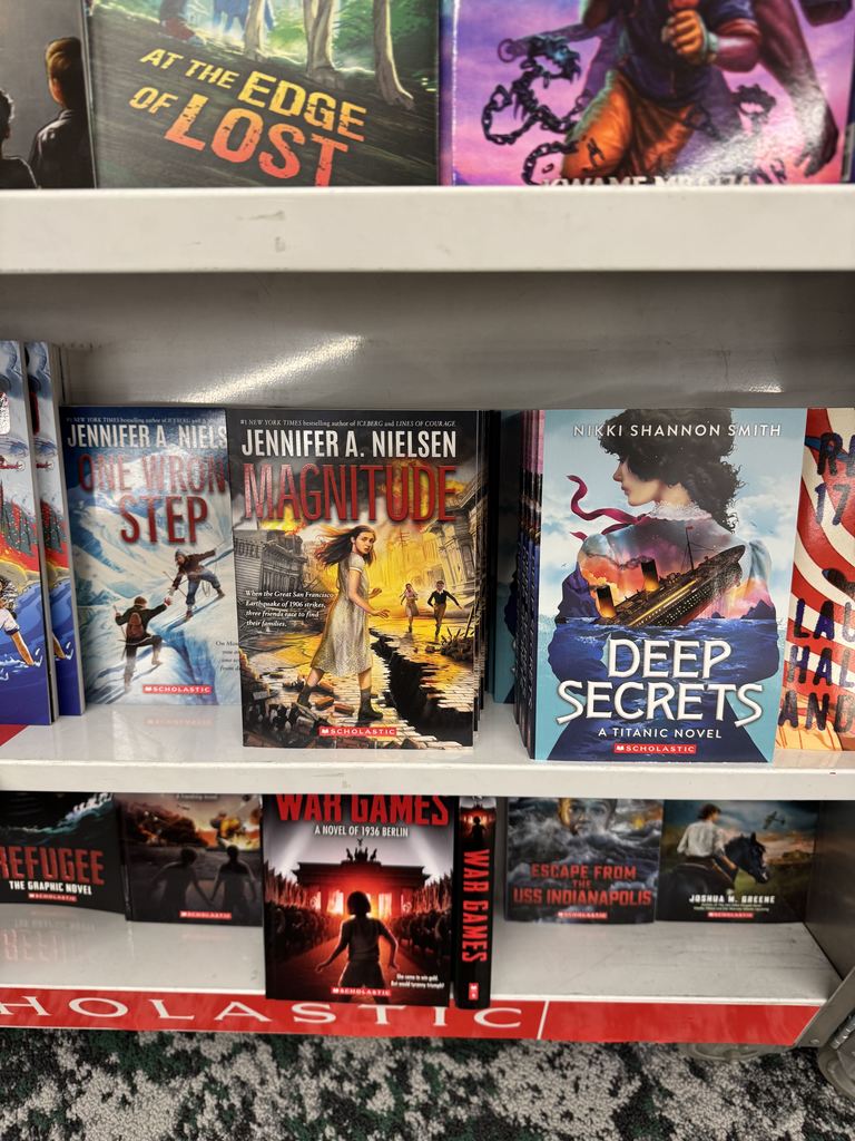 Books on a book cart. 