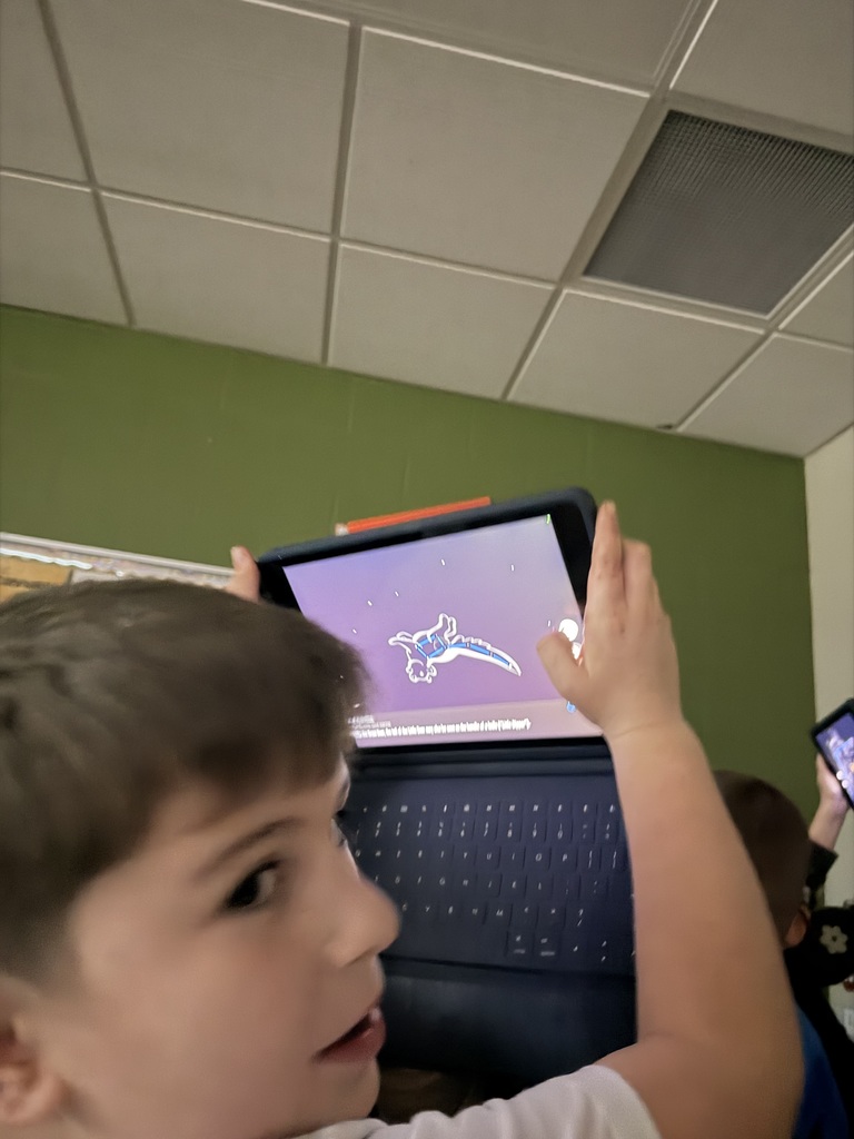 student looking at constellations using his ipad