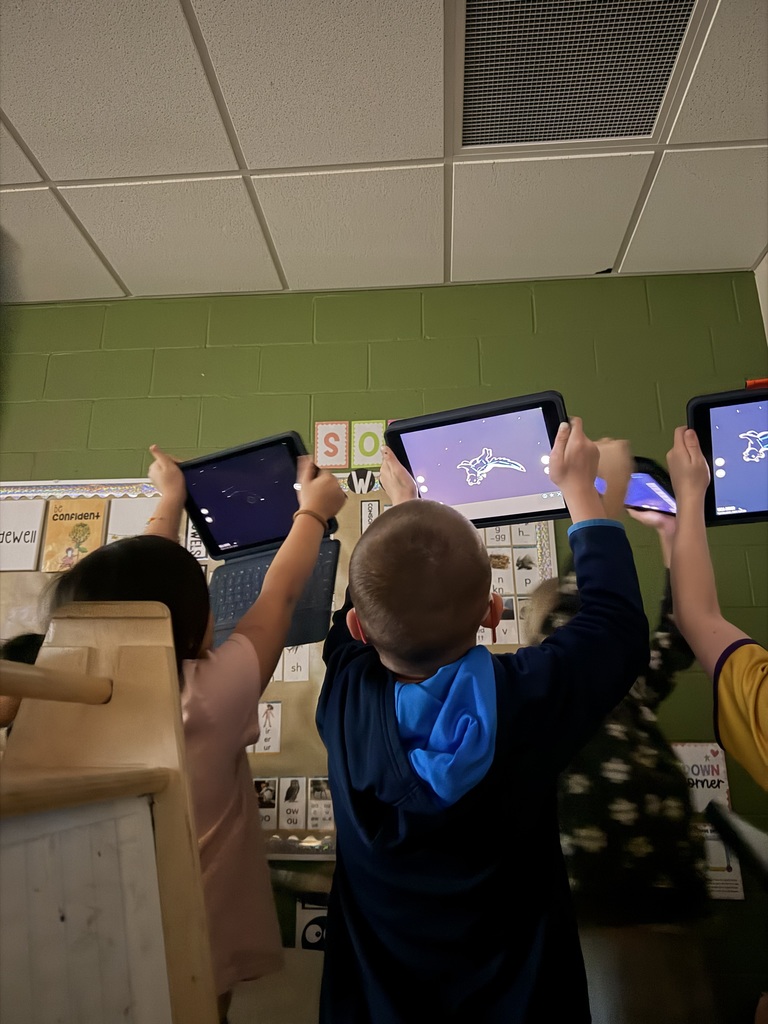 students looking at constellations using ipads