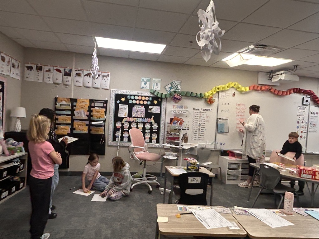 teacher writing compound words on the board