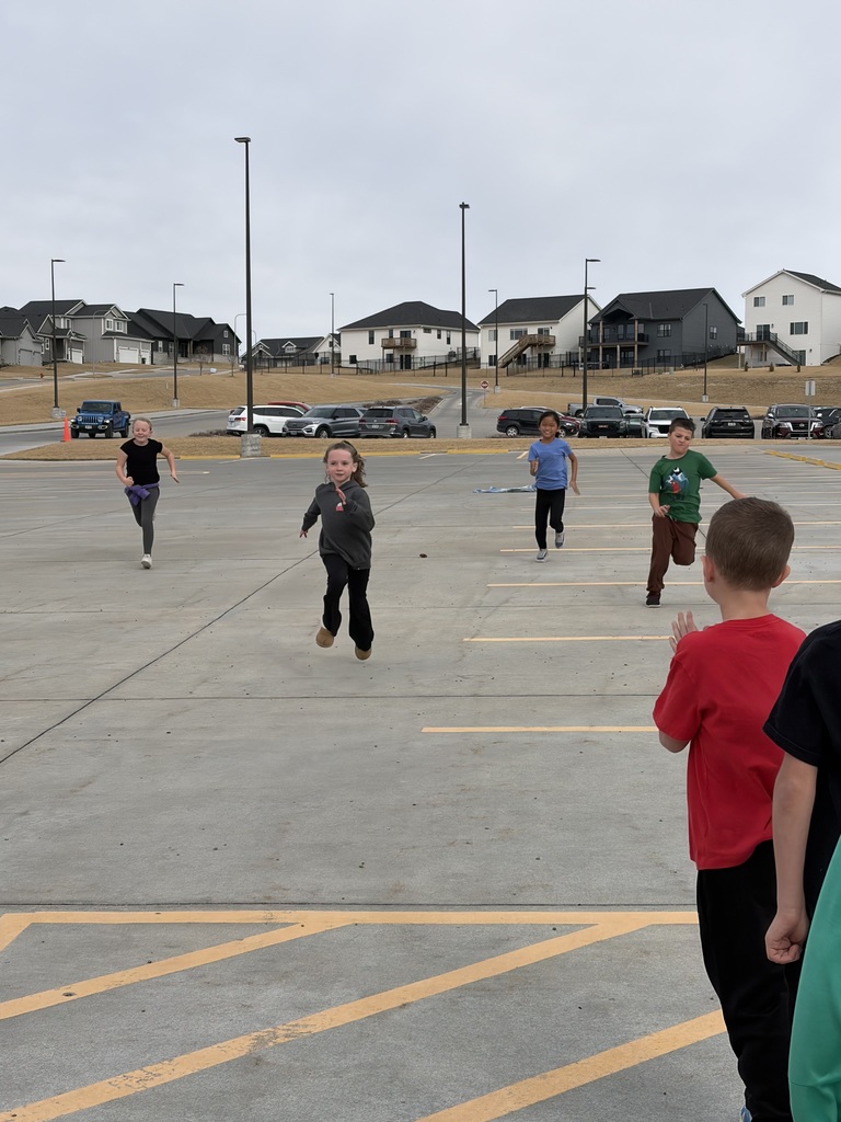 students outside running a sprint