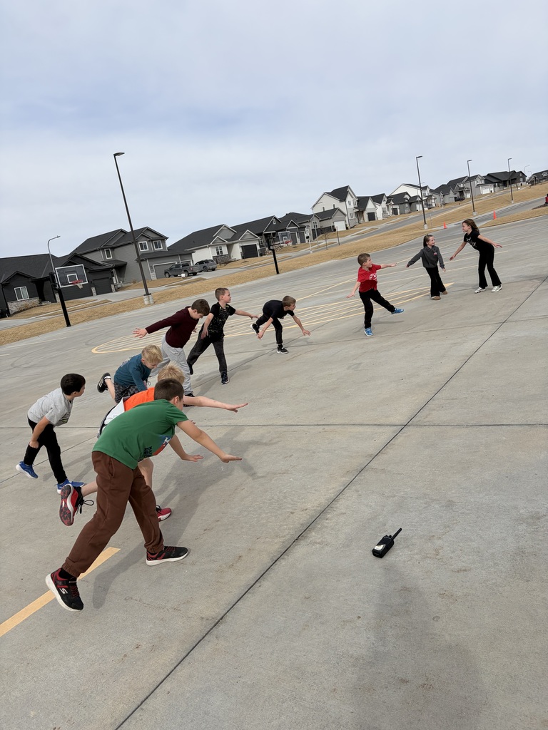 students stretching in the parking lot