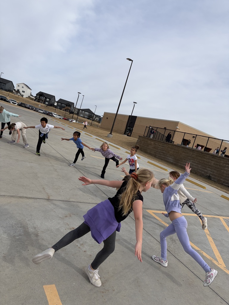 students balancing outside