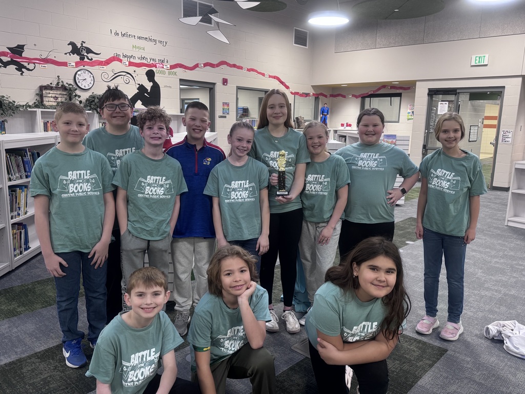 students smiling in a library