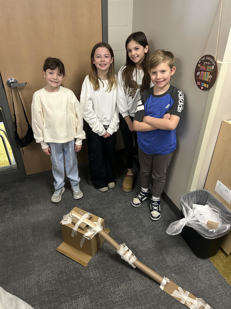 students posing by their make shift skate park