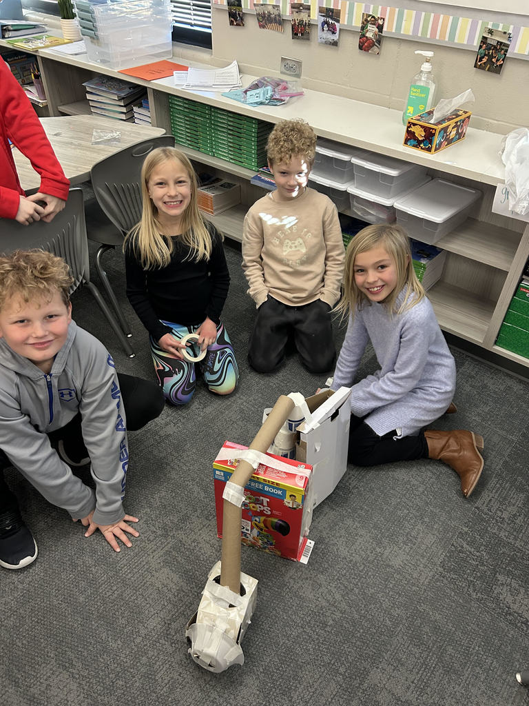 students posing by their make shift skate park