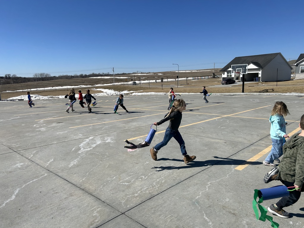student running around with a windsock
